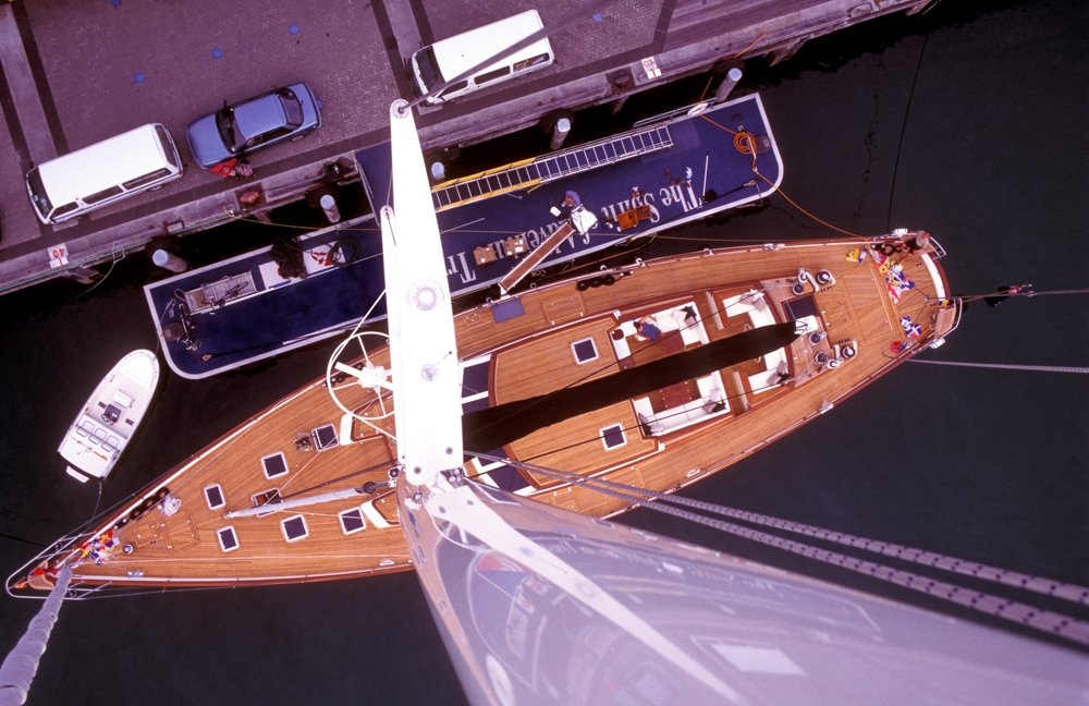 Looking down a yacht mast from the top. Freelancing as a photographer