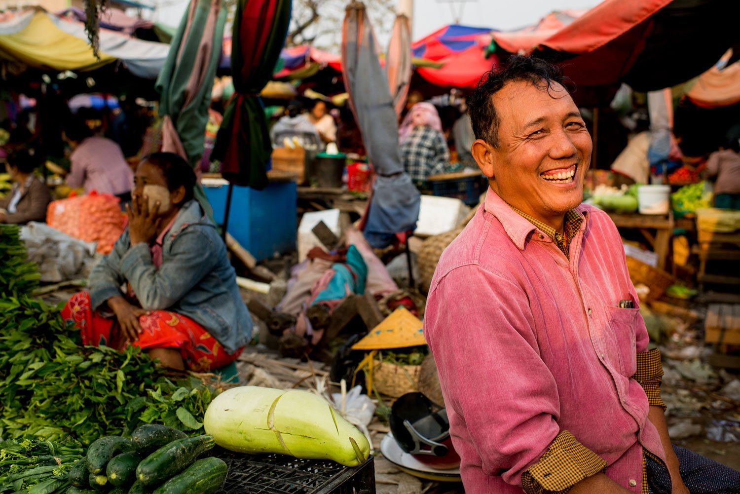 happy market vendor environmentat portrait © Kevin Landwer-Johan