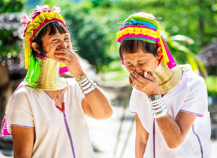 Two long neck Kayan women having a good laugh during a Chiang Mai Photo Workshop