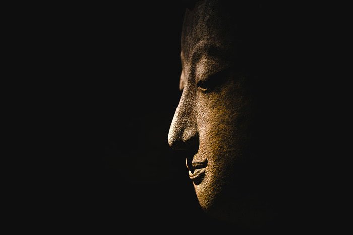 Buddha Statue Face with a dark background