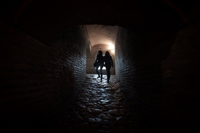 Why I Believe Using Manual Mode Is The Best Option Silhouettes in a Passageway