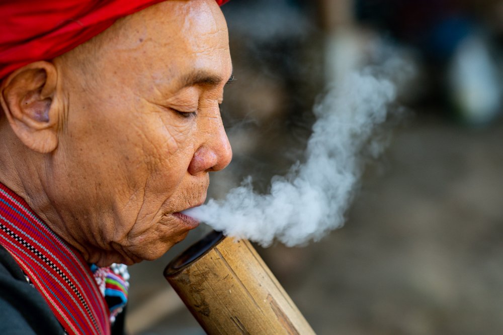 Lahu Man Smoking a bamboo bong photographed during a Chiang Mai Photo Workshop