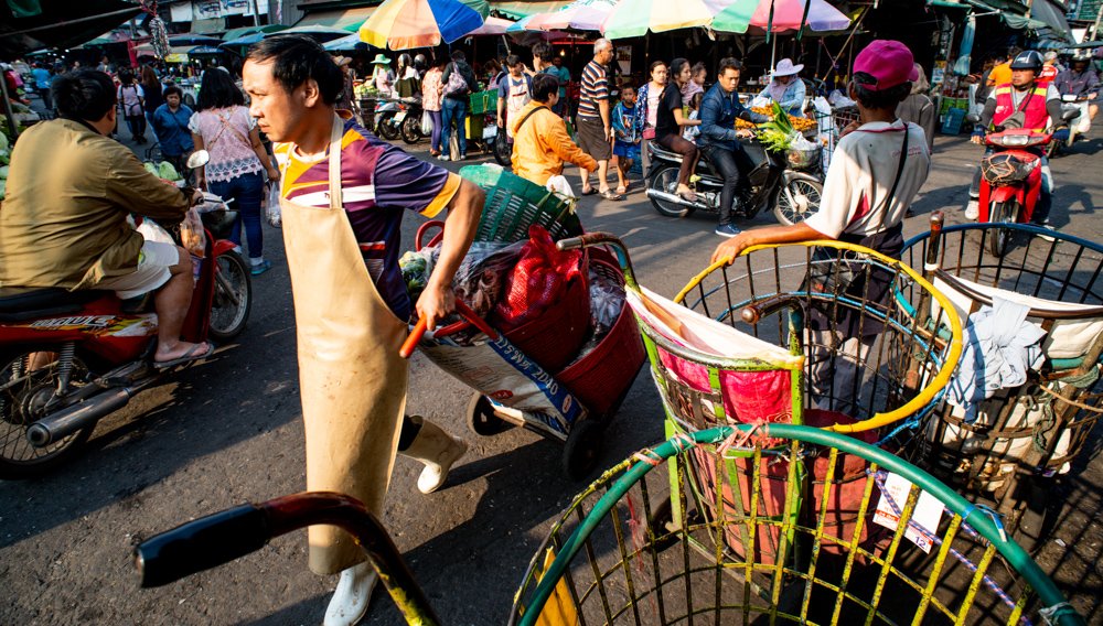 Market Action during a Chaing Mai Photo Workshop at Muang Mai Market, Thailand.