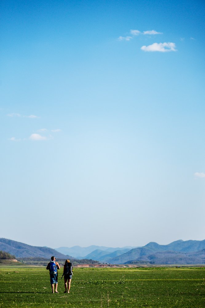 How To Compose the Best Photos – Fill The Frame. Young couple walking together in an empty field.  © Kevin Landwer-Johan