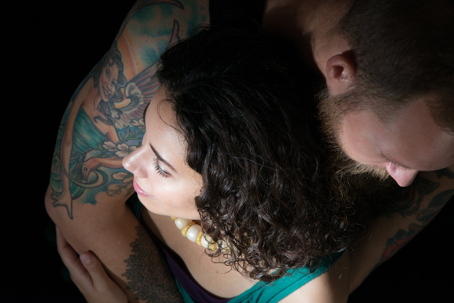 Couple portrait in the studio looking down Why Shy Photographers Can Actually Make the Best Portraits