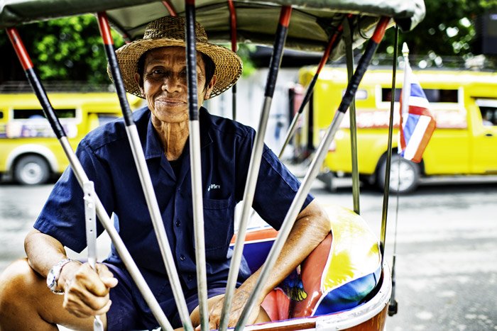 Samlor Rider Resting at the market in Chiang Mai, Thailand. how to tell stories with photos