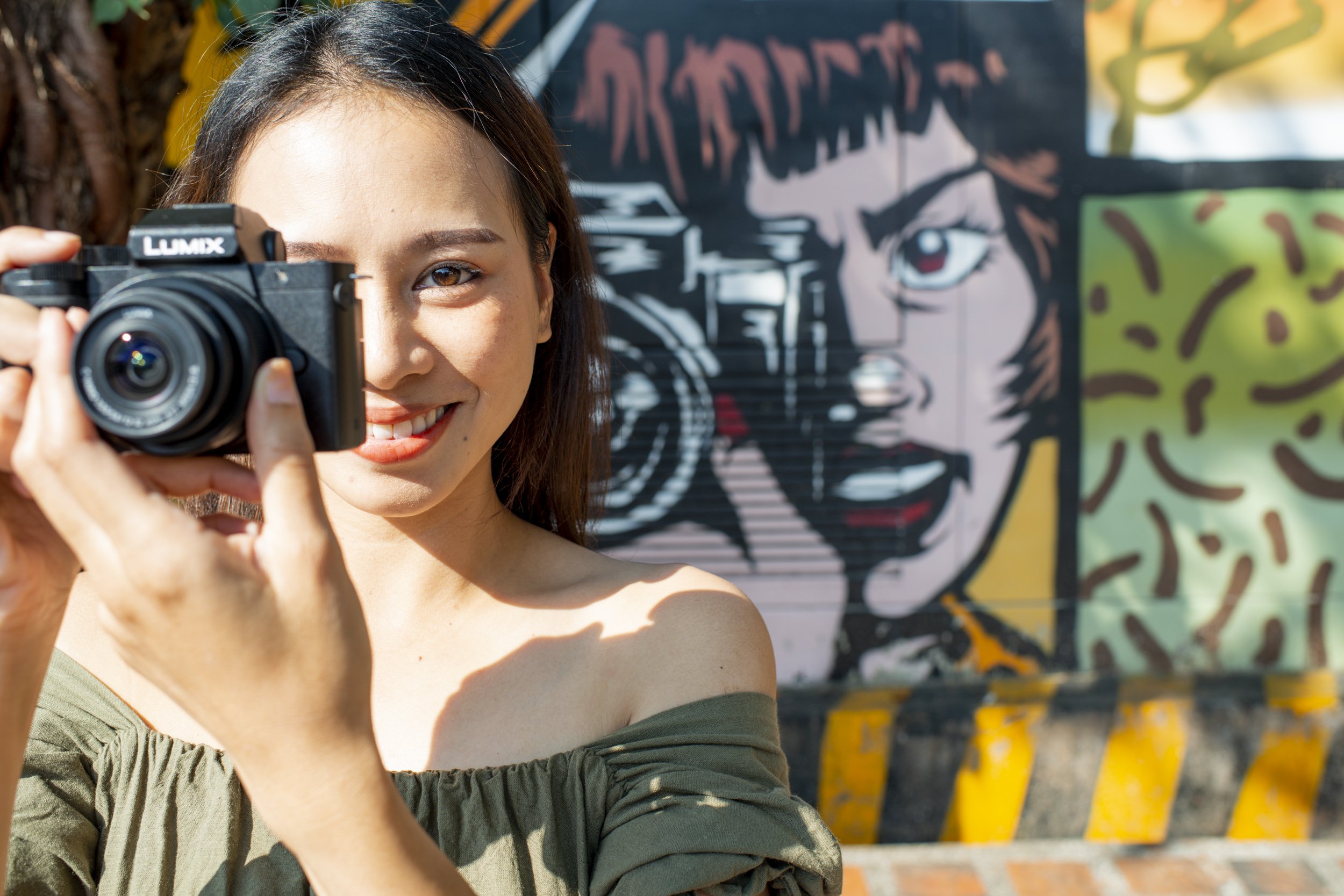 Asian woman taking a photo for photography terms