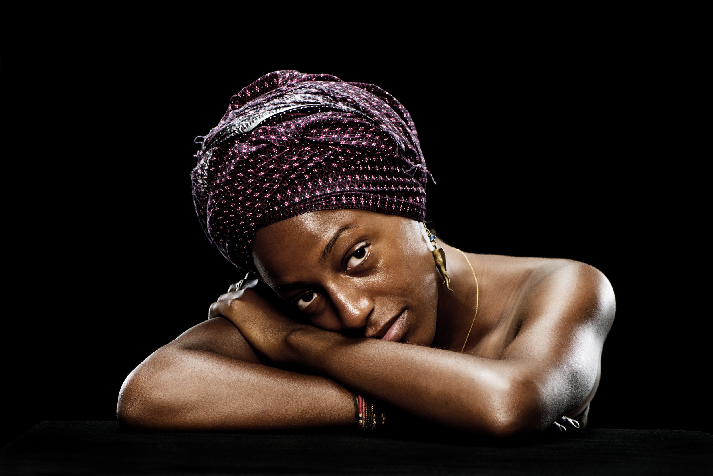 Woman in a headscarf, studio portrait for What is Your Motivation for Taking Photos?