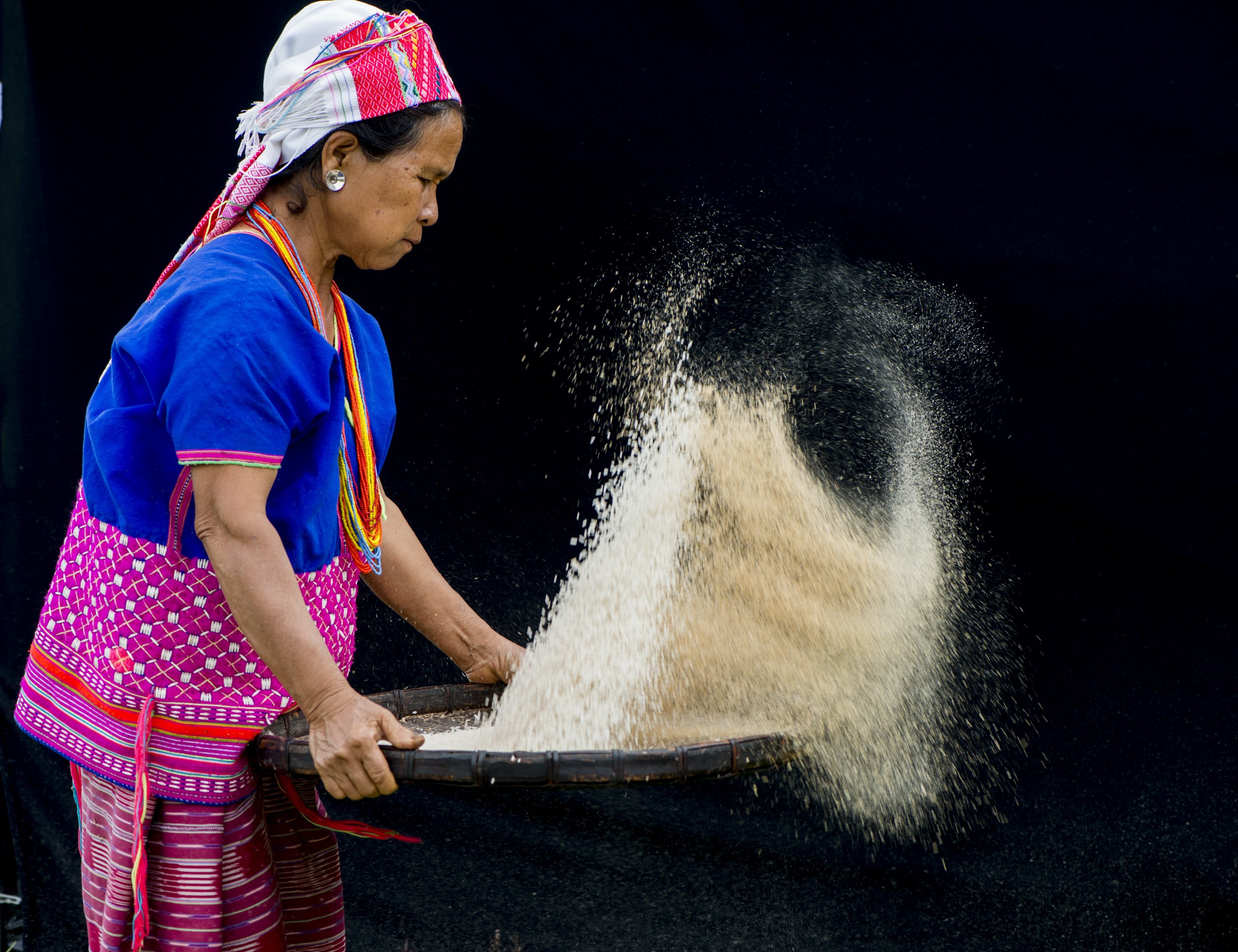 Karen woman processing rice for camera or phone article