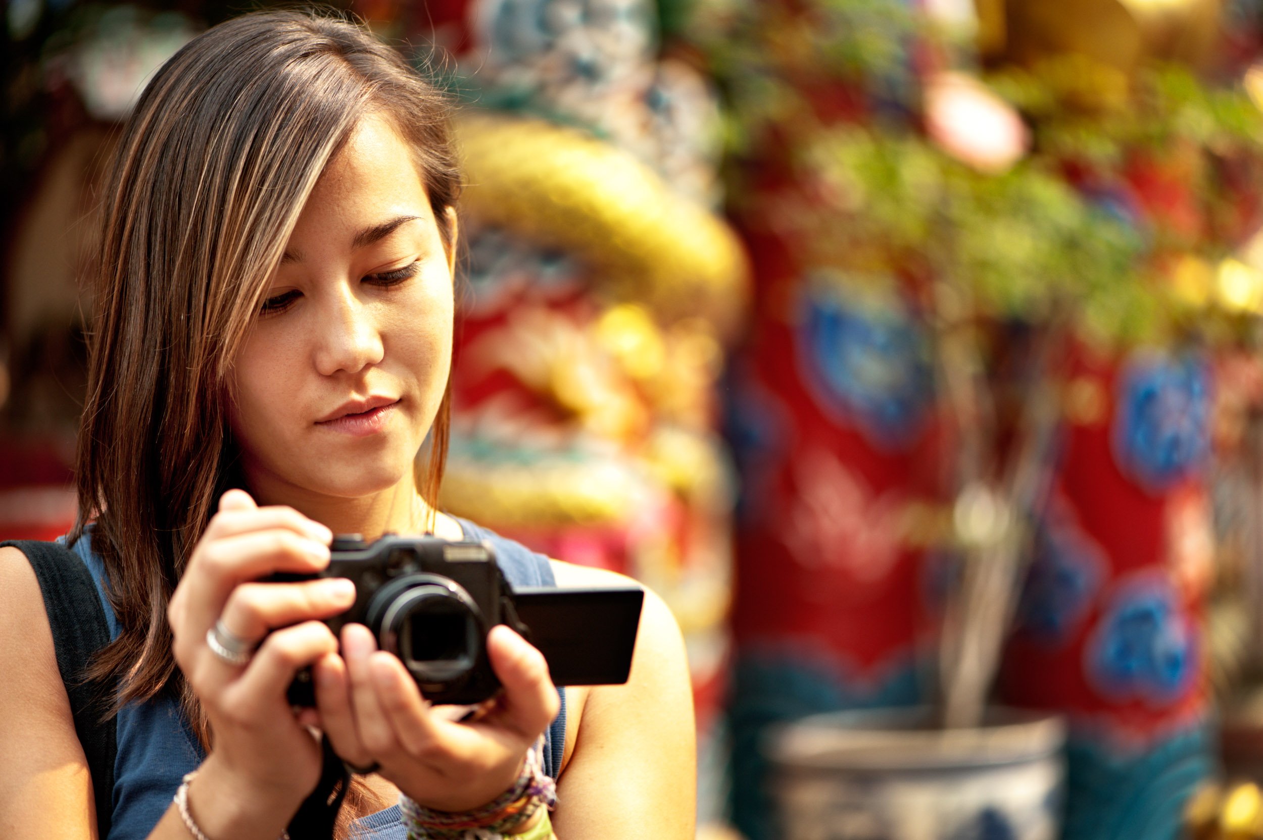 Asian woman with a camera for Photography Mentorship Program