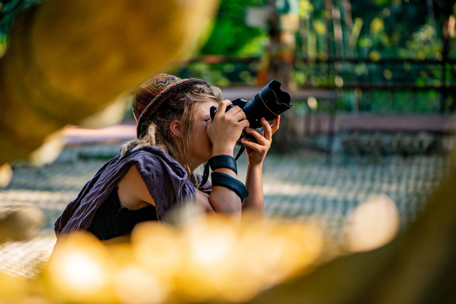 Woman taking a photo with a DSLR camera