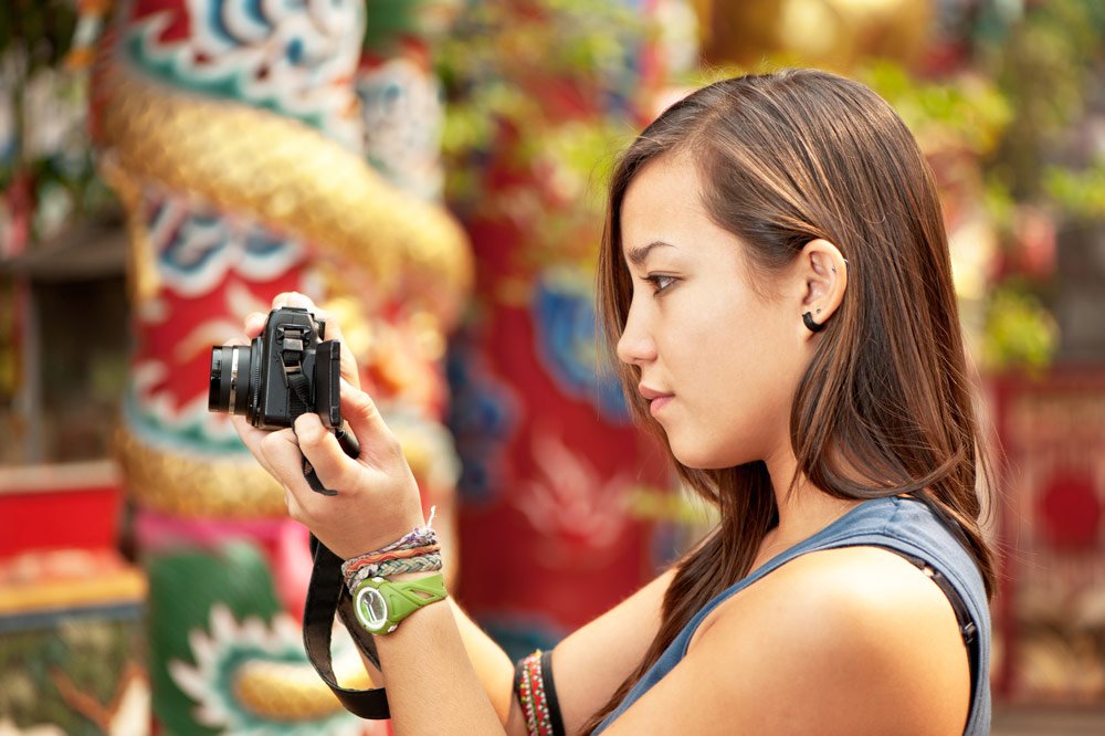 young Asian woman photographer © Kevin Landwer-Johan